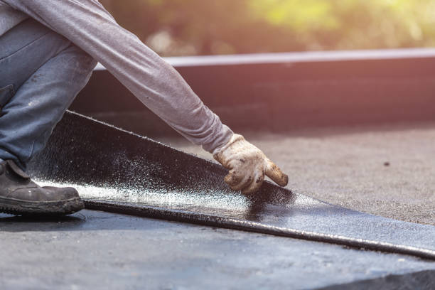 Professional Basement Waterproofing technician working in Harwood, MD